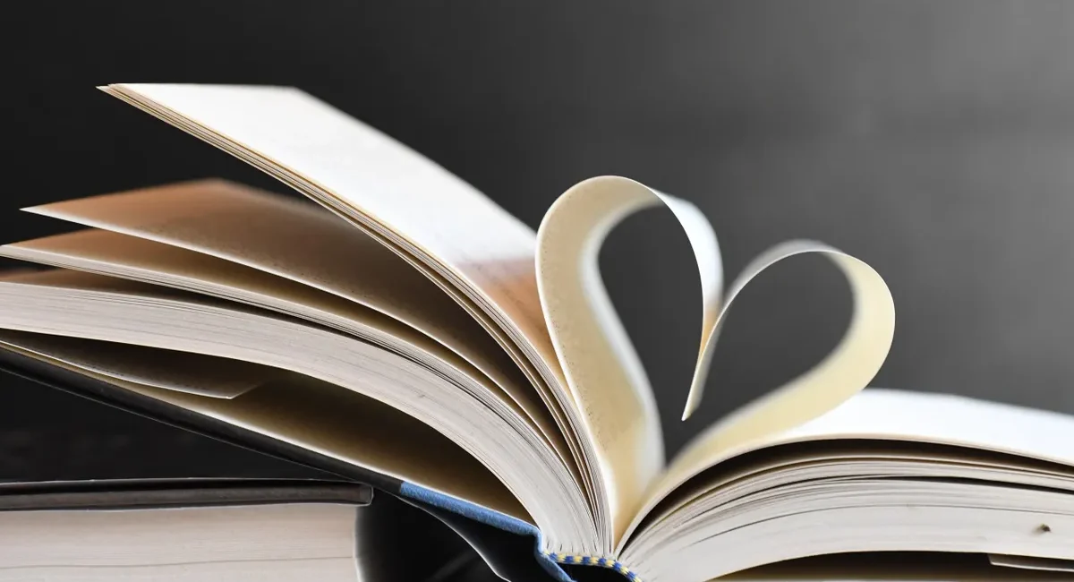 Open book with pages forming a heart, symbolizing love for reading and literature