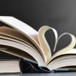 Open book with pages forming a heart, symbolizing love for reading and literature