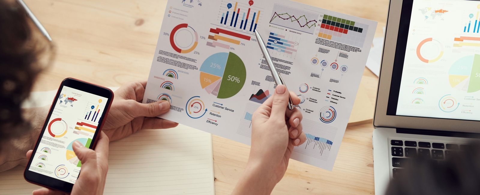 Industry Fluency Separates Standout Search Agencies From the Rest of the Field: marketing specialists reviewing SEO and campaign analytics charts at a desk