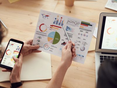 Industry Fluency Separates Standout Search Agencies From the Rest of the Field: marketing specialists reviewing SEO and campaign analytics charts at a desk